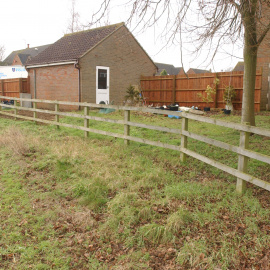 Close-up of the garage area, with clear access from the field, just a fence-hop over.