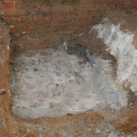 Further excavation into the second layer of mortar.