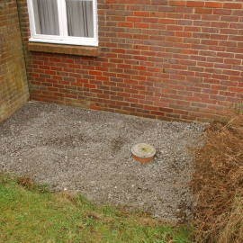 Close-up of one of the areas of underpinning at 2 Prospect Close. The concrete here has been gravelled over.