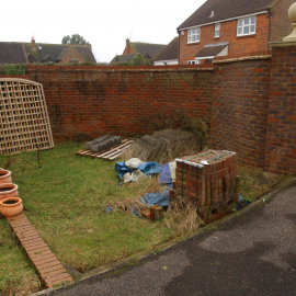 More building materials at the rear: kerb stones, slabs, bricks, and trellis panels. Sami purchased and collected the fencing materials on 21 August 2009.