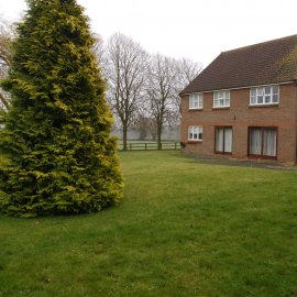 The back-garden of 2 Prospect Close. Notice how easy access from the neighbouring field is with just a small fence.